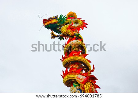 Dragon statue Style China on the roof in Thailand
