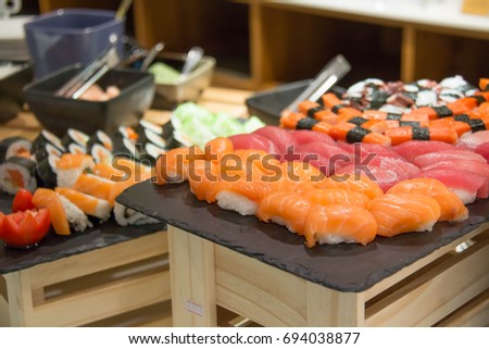 Colorful set of japanese sushi maki rolls with salmon, tuna  served on  plate