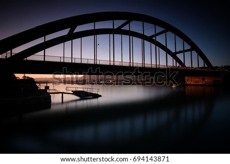 An arched bridge taken at sunset and a long exposure makes the photo a little more dreamy 