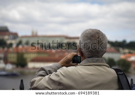 Man taking pictures of the city landscape