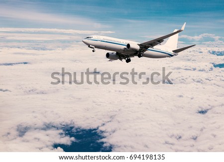 The plane above the clouds, the background of travel subjects.