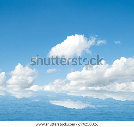 Sea clouds reflected in water