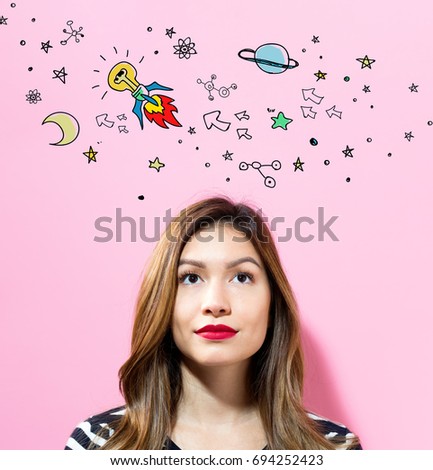 Idea Rocket with young woman on a pink background