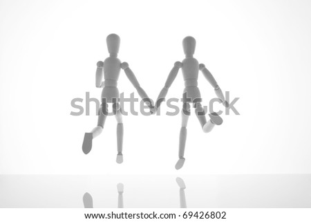 Running dolls holding hands