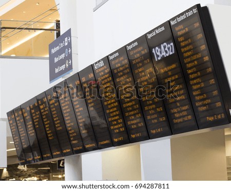 Large train station departure and arrivals board