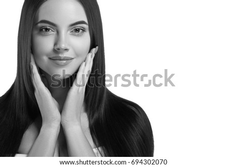 Beautiful woman face closeup portrait hands on skin black and white