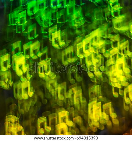 Beautiful background with different colored note, abstract background, note shapes on black background, blurry