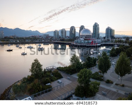 False Creek with Dowtown Vancouver, British Columbia, Canada, in the background. Picture taken from an aerial perspective during a summer morning sunrise.