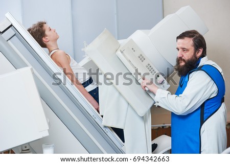 Radiology specialist at work. male radiologist in protective wear