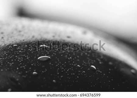 Drops of water on blue and black surface. Macro photo, drop, shadow plastic base. helmet bokeh