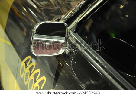 Vintage car side mirror with chrome finish. 