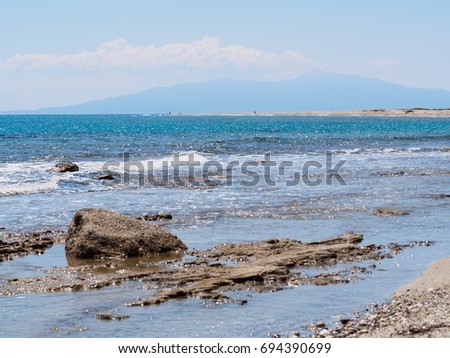 Wave splash and rocks on a sea shore