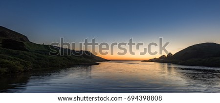 Sunset over Rodeo Beach and Fort Cronkhite. Royalty-Free Stock Photo #694398808