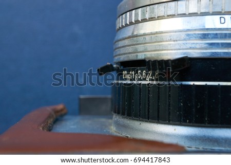 closeup of old retro camera lens with aperture numbers