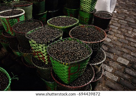 Lots of Acai, traditional fruit in this area, inside baskets in Belem, a city on the north area of Brazil. Acai os a small fruit from the Brazilian amazon, very rich in nutrients and antioxidants.