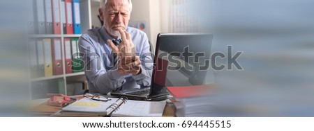 Businessman suffering from wrist pain in office