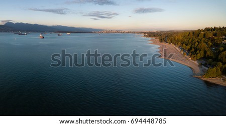 Aerial view of Spanish Banks Beach with Downtown Vancouver, British Columbia, Canada, in the background. Picture taken during a sunny summer sunset.
