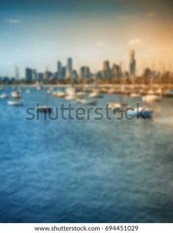 Blurred unfocused picture of boats in city