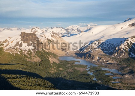 Beautiful aerial landscape view of the mountains in Garibaldi Provincial Park. Picture taken from an airplane between Whistler and Squamish, North of Vancouver, British Columbia, Canada.