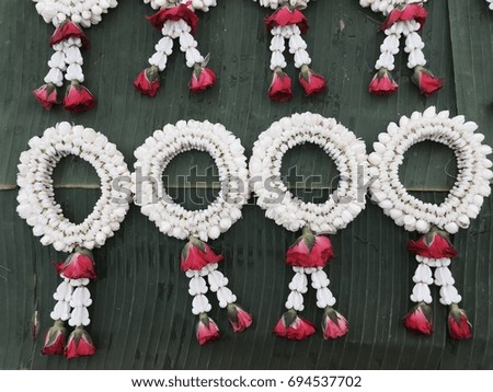 Garland flower on banana leaf for selled, Symbol of Mother's day in thailand.