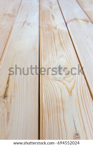 Vertical photo of a new light wooden texture floor. Close-up