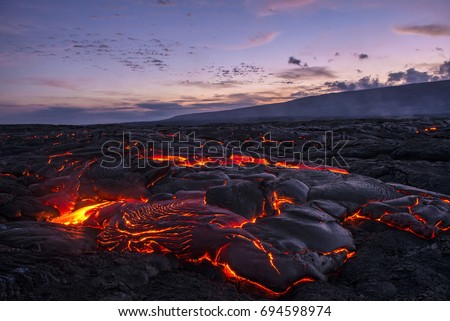 hawaiian lava sunset Royalty-Free Stock Photo #694598974