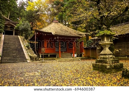 A shrine and autumn leaves