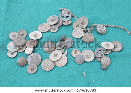 French buttons from the Crimean War on the green canvas