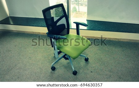 Green office chair isolated with retro / vintage effect