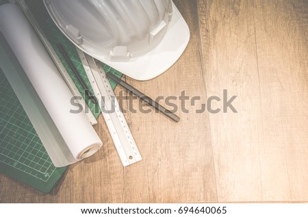Top view desk engineer background, Construction helmets and ruler on wood desk