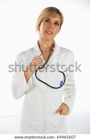Nurse standing with stethoscope in her hand, thinking