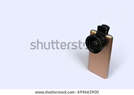 Clip lens with mobile phones in white background.