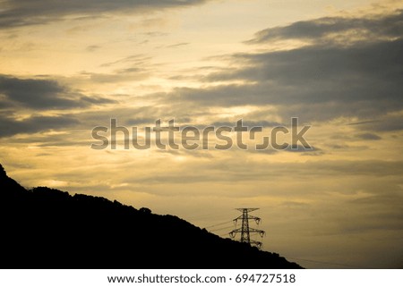 The silhouette of the evening electricity transmission pylon in Hong Kong