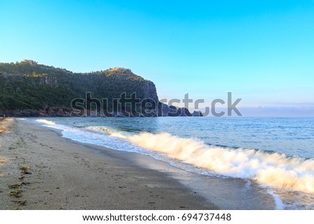 kleopatra beach in alanya with fortress background