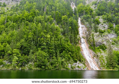 Amazing natural view of small waterfall in deep forest landscape background
