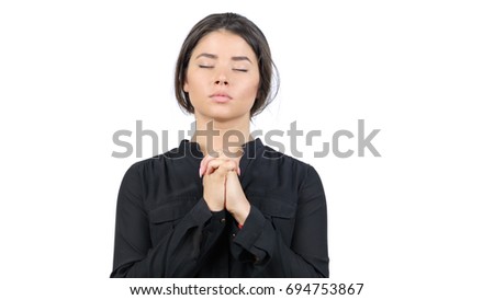 Beautiful young teen girl prays. Close up portrait female Praying