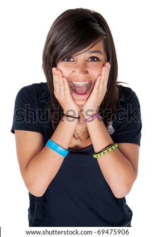 Young latina girl surprised and hands on chin with big smile on white background
