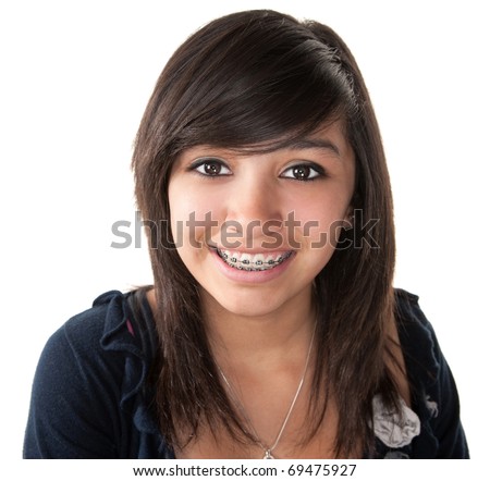 Cute Hispanic teenage girl smiling with braces on a white background