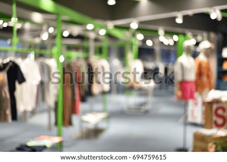 Abstract Blurred image, Clothes shop in shopping mall and interior , for background.