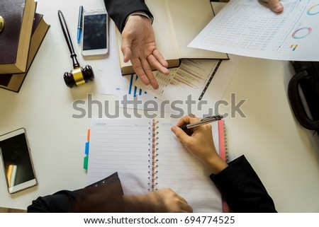 Consultation between a business lawyer, a tax lawyer, and the company's financial statements regarding real estate sales.