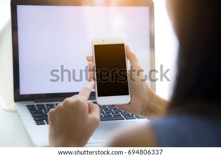 This image is a picture of a working woman using a mobile phone. The concept is technology.