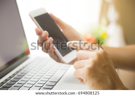 This image is a picture of a hands playing a smart phone.  The concept is technology,working woman,business,communication.