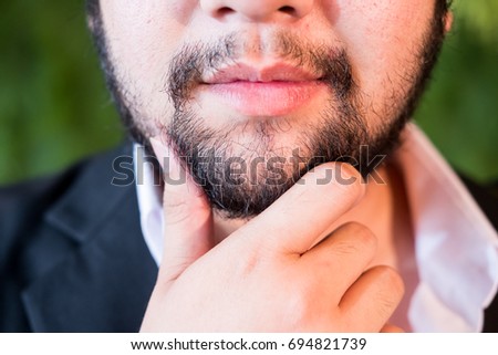 Portrait of Asian young man with mustaches and Beard
