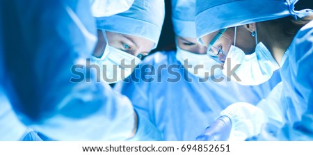 Team surgeon at work on operating in hospital Royalty-Free Stock Photo #694852651