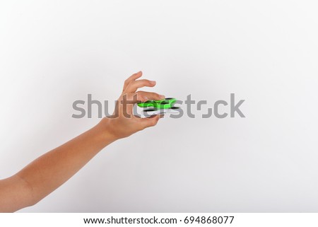 Hand playing with two fidget spinners