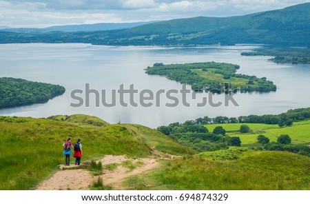 Panoramic sight from Conic Hill, Balmaha, village on the eastern shore of Loch Lomond in the council area of Stirling, Scotland. Royalty-Free Stock Photo #694874329
