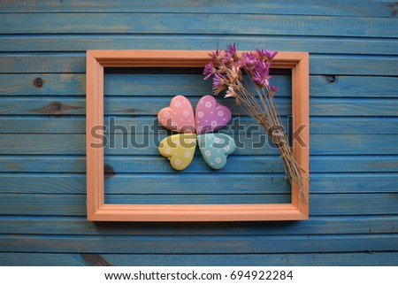 Wooden photo frame on old wooden blue background