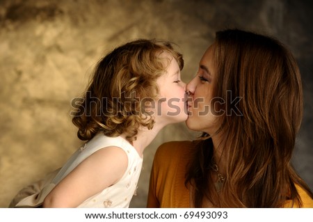 A little girl and her young mother together