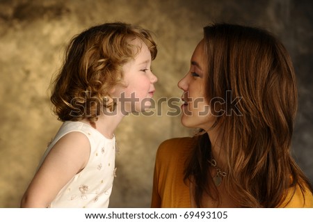 A little girl and her young mother together
