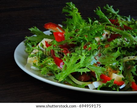 Vegetarian autumn salad. Frisee salad with white cheese.